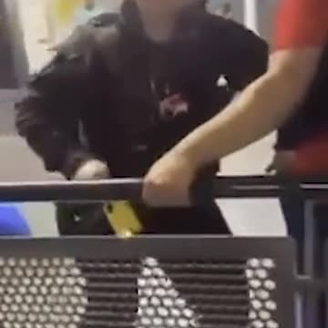 Moment police confront holidaymakers at Manchester Airport