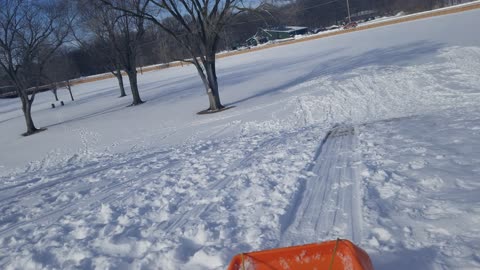 Sledding at the golf course