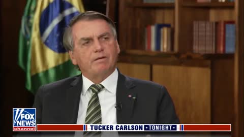 Brazilian President Jair Bolsonaro talk to Tucker Carlson