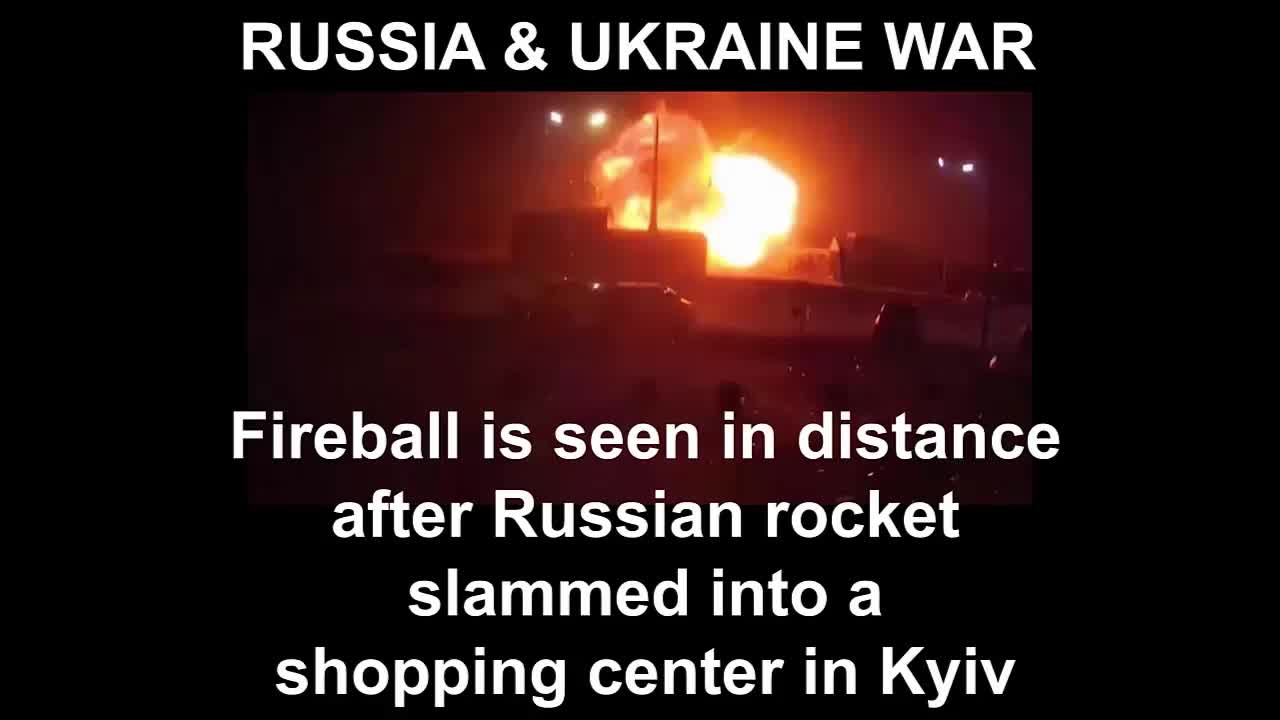 Fireball is seen in distance after Russian rocket slammed into a shopping center in Kyiv