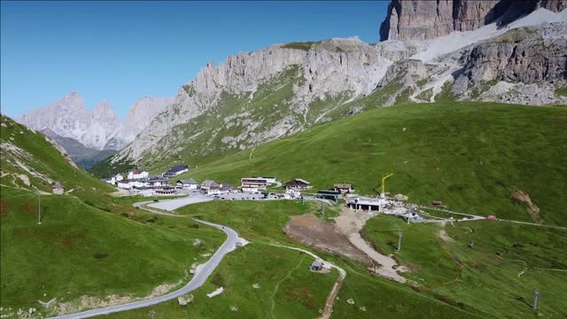 tourist infrastructure in the dolomites mountains in italy aerial drone view