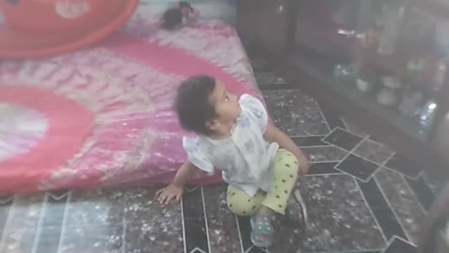 Cute baby afraid look a ghost in the TV