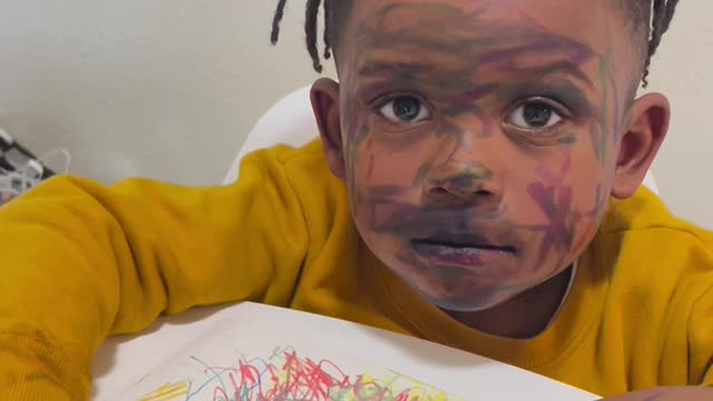 Child with Marker on His Face Plays Innocent