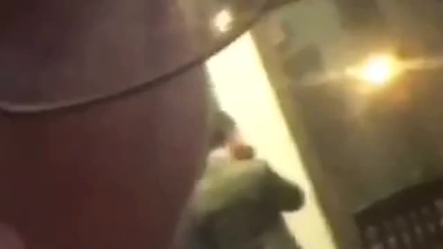 Guy in back being filmed by guy in blue