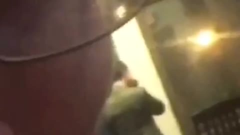 Guy in back being filmed by guy in blue