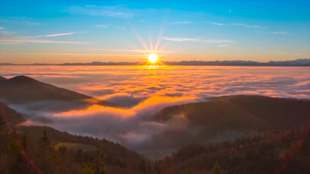 The sun rises above the clouds