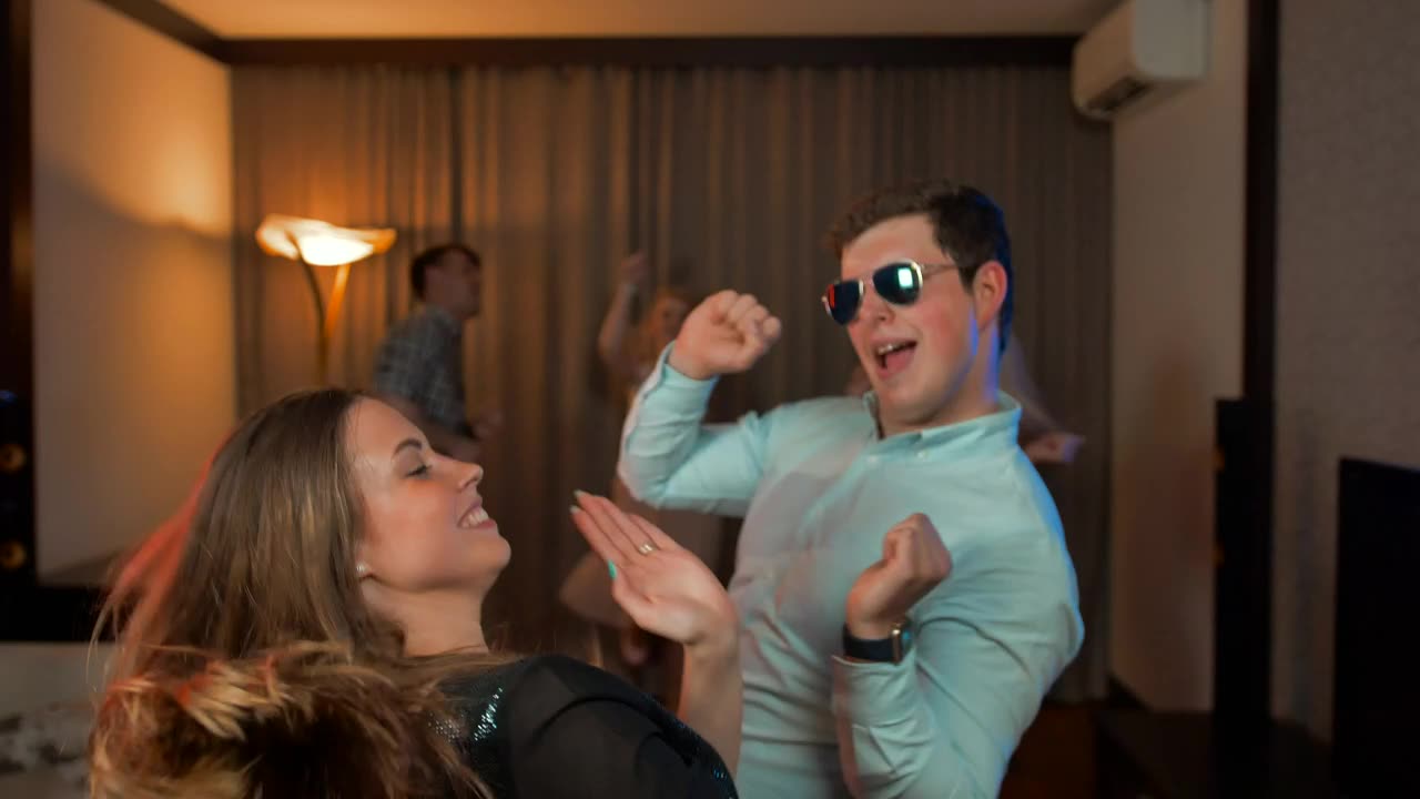 Group of friends partying happily