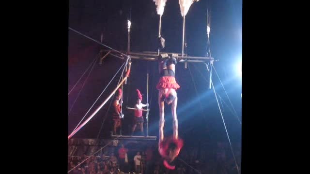 Men dressed up as ladies doing trapeze. Amazing!