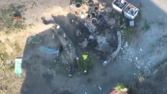 Russian Quadcopter dropping grenade on Ukrainian position