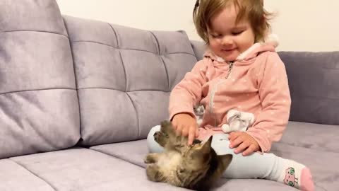 Cute baby and cat