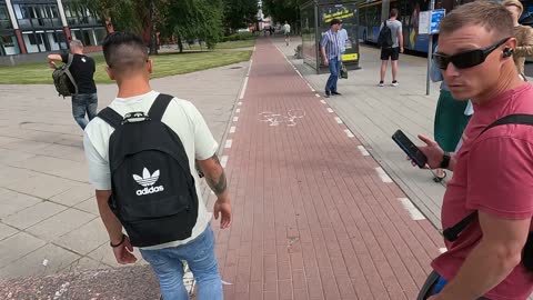 Funny street dancers crossing bicycle pathway