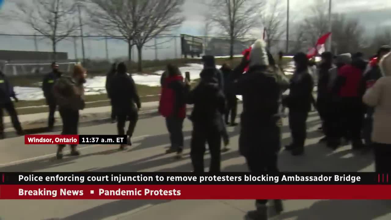 Police move to clear protesters blocking the Ambassador Bridge in Windsor, Ont.