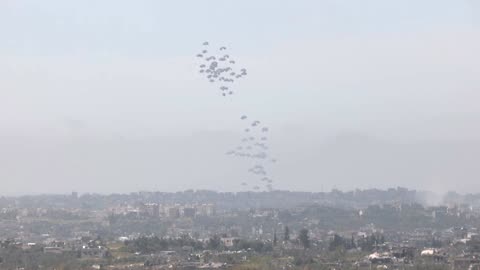 Pallets of aid are airdropped into northern Gaza