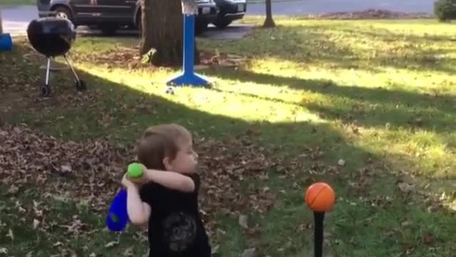 4 year little old boy put a ball into the basket. unbelivable