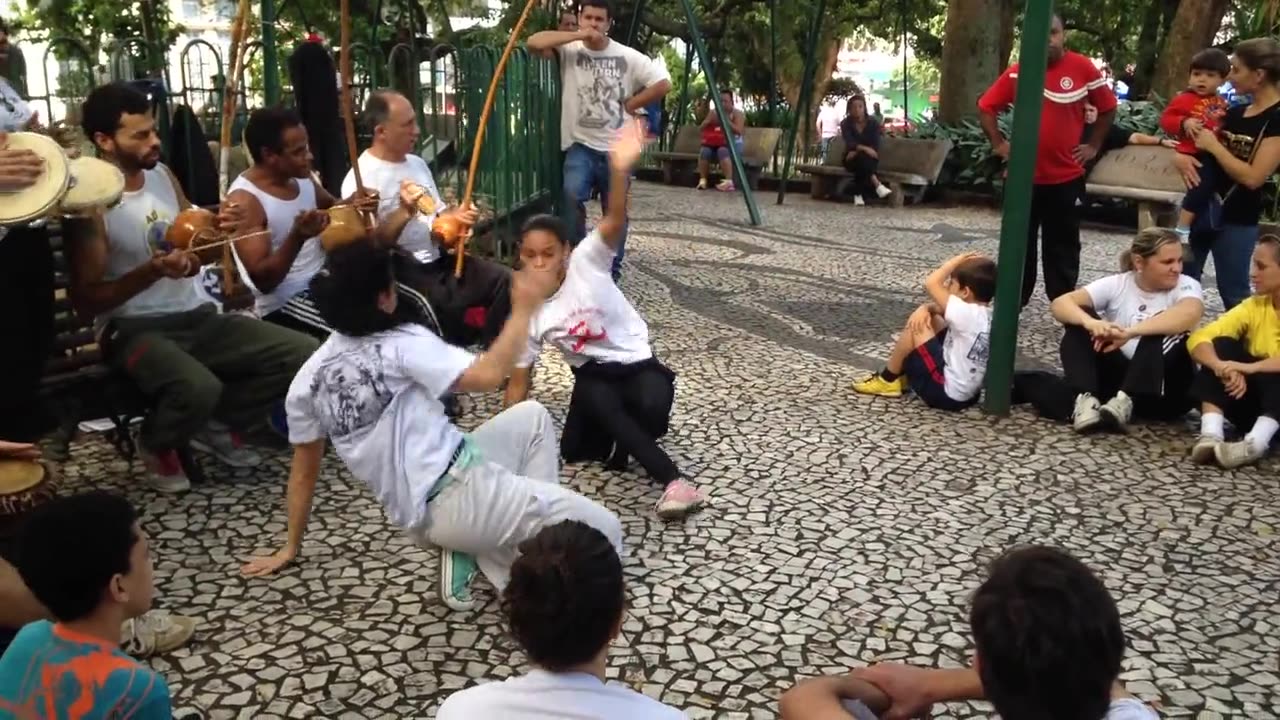 Women And Man Performs Martial Art Dance