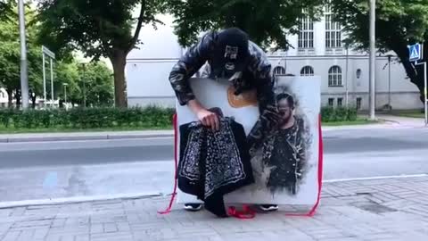 Magician Brings Dog Out of Their Painting While Showing Trick on Street