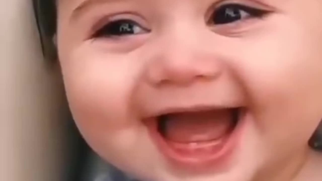 "Baby Bliss: Laughing Babies Bring Joy to the World!"