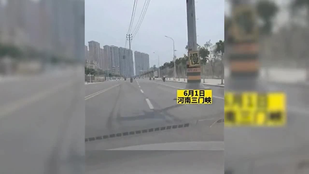 Someone Records A Highway In China, Demonstrating Electricity Poles Strewn About The Lanes