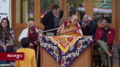 Dalia Lama kisses a little boy