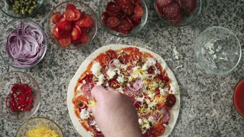 man making a pizza