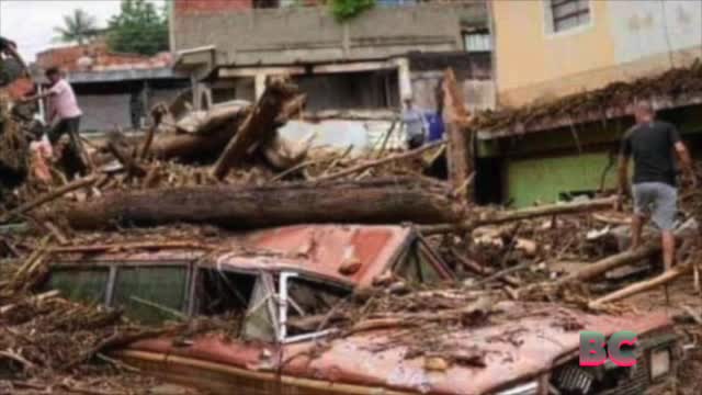 A rain-fueled landslide sweeps through Venezuela town, leaving more than 20 dead