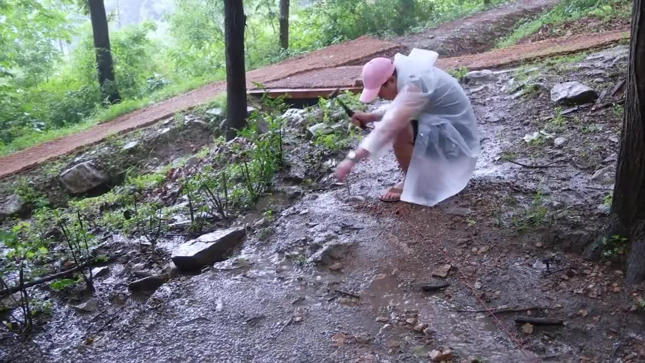 Camping in the rain, enjoying outdoor food alone