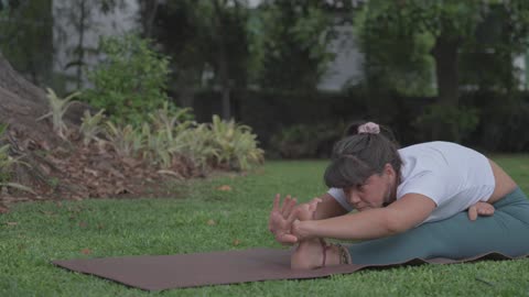 Girl Doing The Head to Knee I Yoga Pose