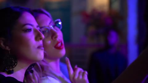 two-women-taking-a-selfie-while-dancing