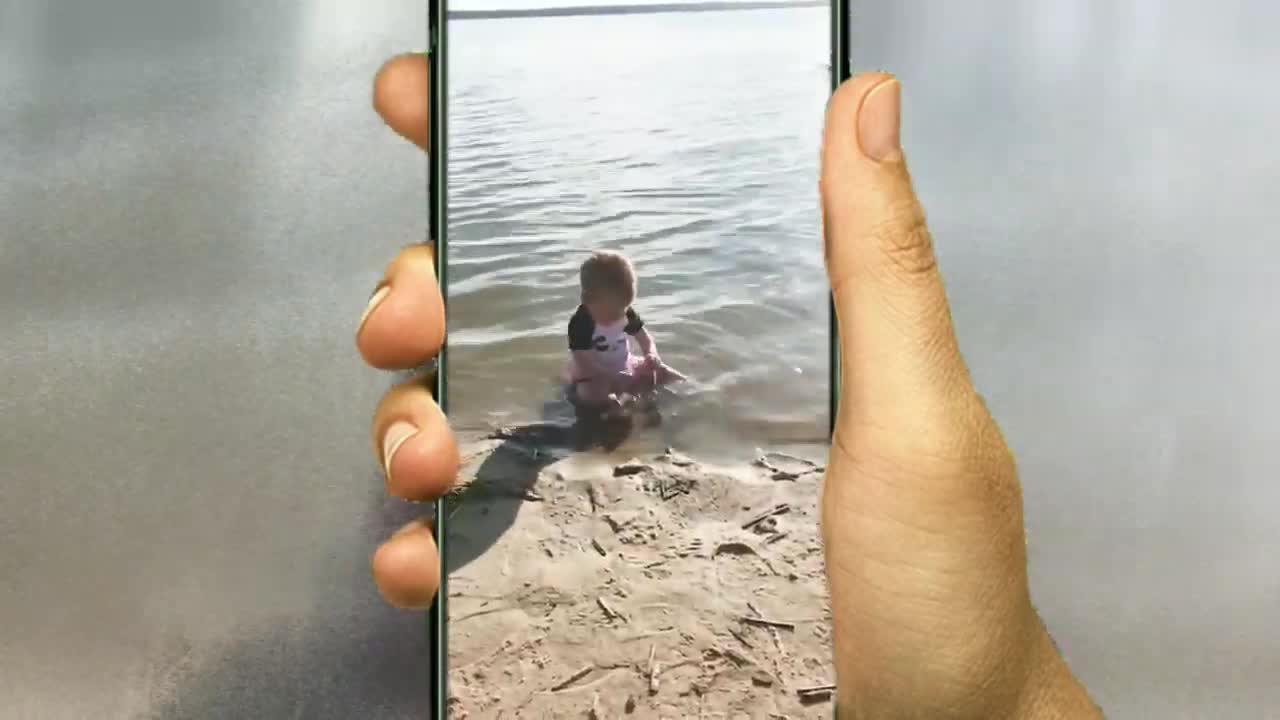 Baby playing with water in a cute video