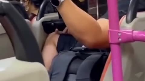 Man spews vulgarities & raises fist at female bus passenger