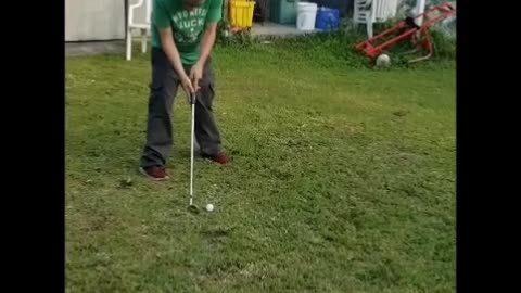 Trying to teach my friend David how to golf.