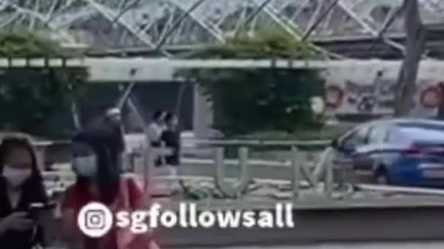 Taxi drives along MBS walkway on 3 Oct