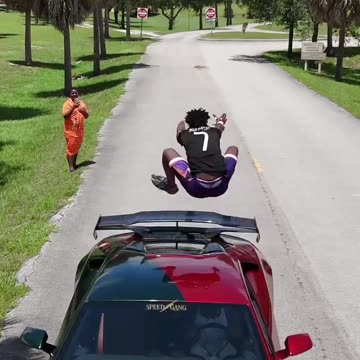 Ishowspeed just jumped over a Racing car 🤯