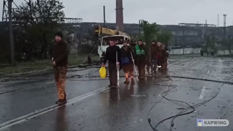 Large numbers of Ukrainian POWs marching out of Azov steel to surrender to Russian forces