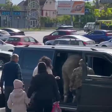 Ukrainian Nazis trying to kidnap a guy to send him into the war