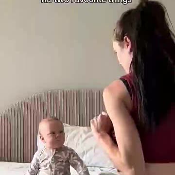 Baby gets reminded of his two favorite things