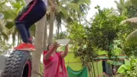 Guy Dips Hair in Bowl of Water Held By Woman While Doing Backflip