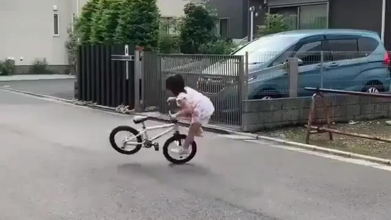 Kid's awesome bike stunt skills.