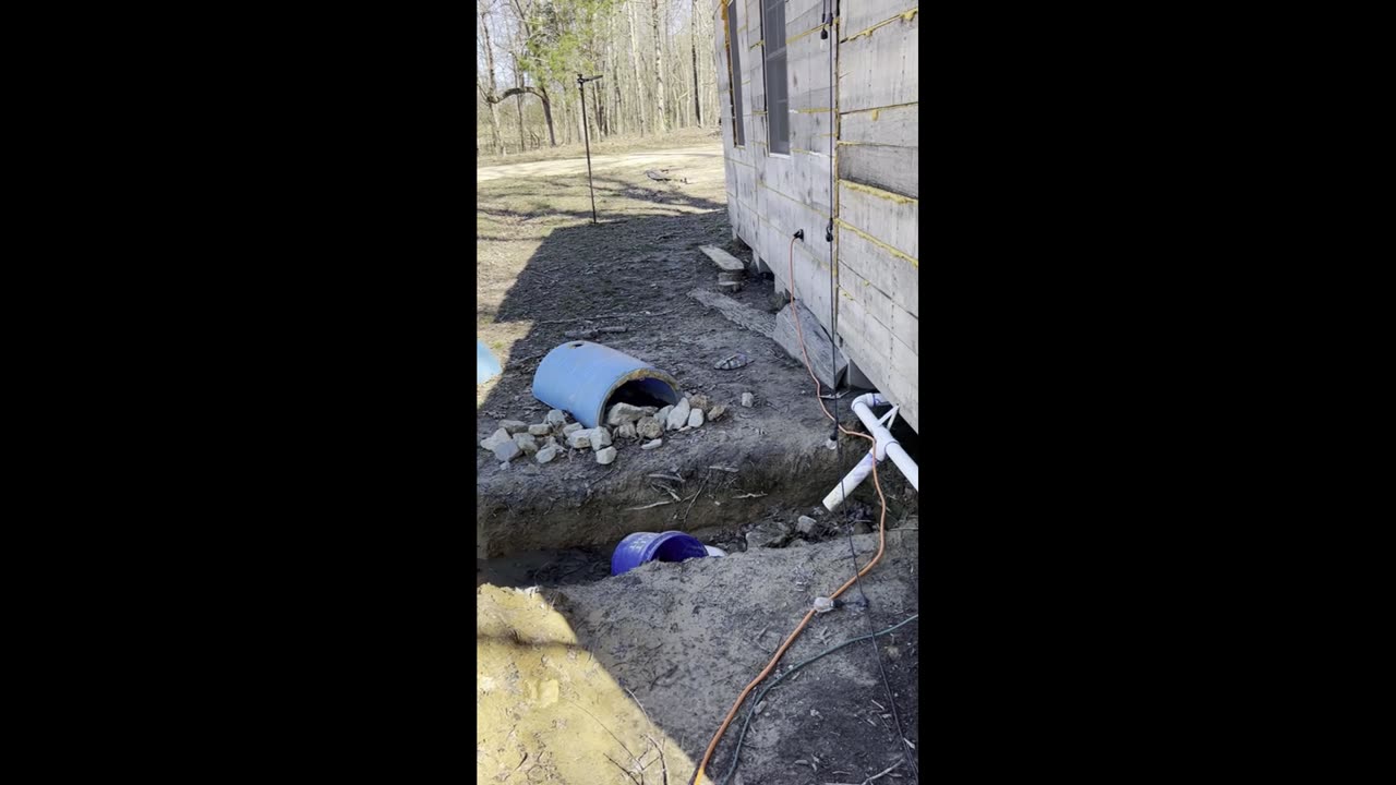 Off grid bath house equipped with compost toilet, hot water, shower, and sink.