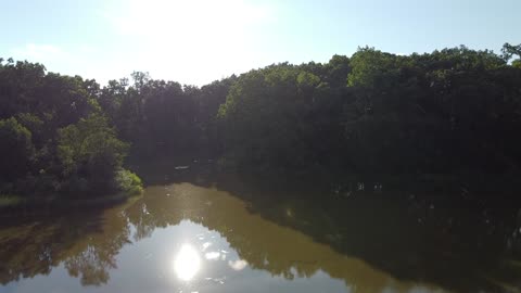 Neighborhood Pond at Sunset from a Drone