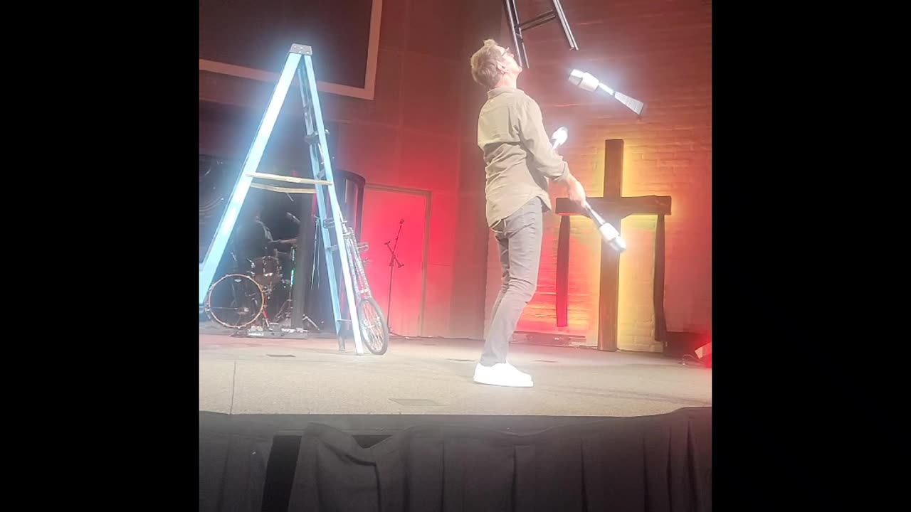 Ron Pearson is juggling with a chair on his face!