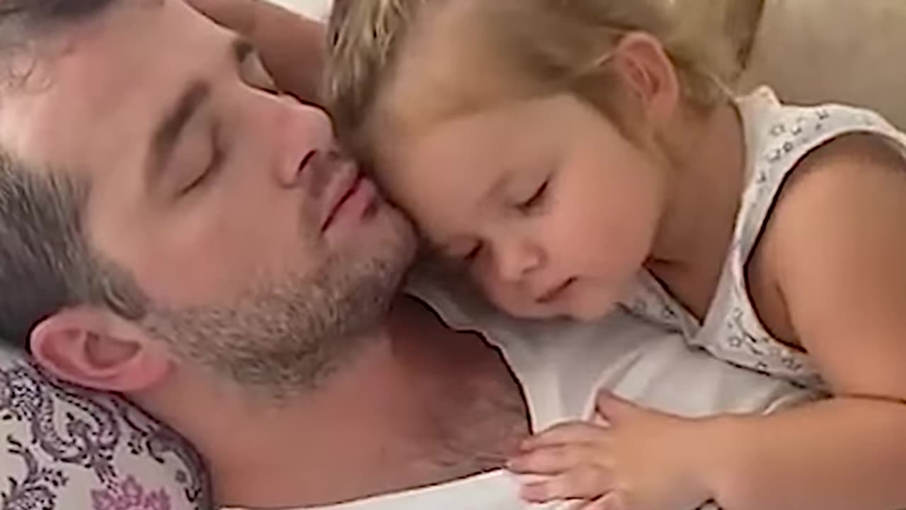 Dad And Babies Share Precious Moments.