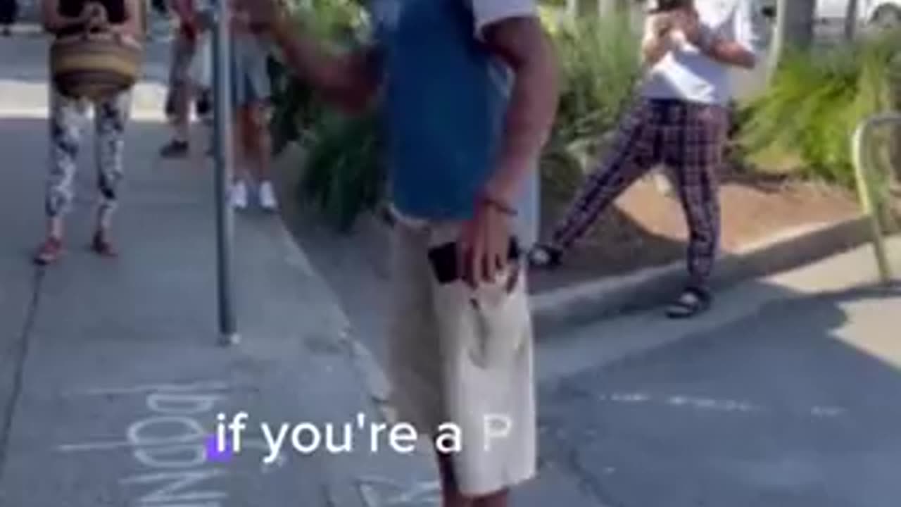 Aboriginal man debates with "YES" campaigners