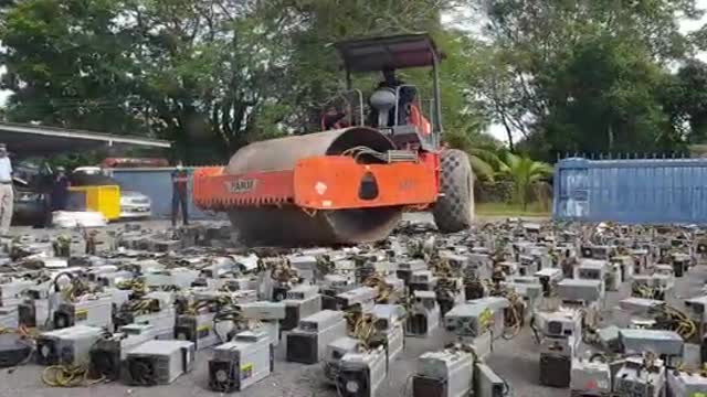 Watch Malaysia (quite literally) destroy over $1 million worth of Bitcoin rigs!