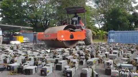 Watch Malaysia (quite literally) destroy over $1 million worth of Bitcoin rigs!