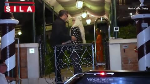 Lady Gaga looks chic in polka dot mini dress as she plants a kiss on fiancé Michael Polansky