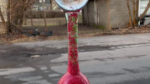 Satisfying Beads Moving Through Glass Bottles