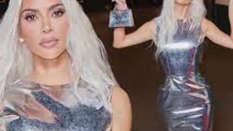 Kim Kardashian Nearly Spills Out Of Tiny Silver Top