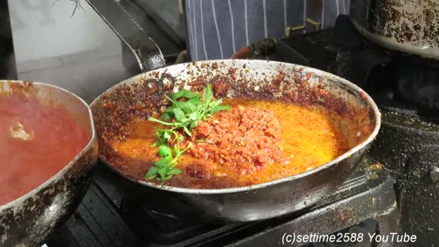 London Street Food. Cooking a Perfect Italian Pasta With Red Pesto