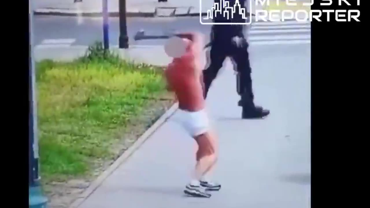 Poland Police confront a Ukrainian citizen casually waving an axe around the street